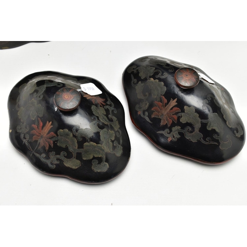 999A - A PAIR OF ORIENTAL BLACK LACQUERED PAPIER MACHE TEA CANNISTERS AND COVERS OF SHAPED OVAL FORM, the d... 