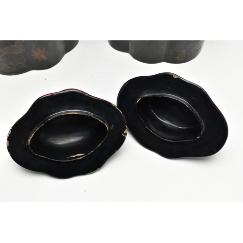 999A - A PAIR OF ORIENTAL BLACK LACQUERED PAPIER MACHE TEA CANNISTERS AND COVERS OF SHAPED OVAL FORM, the d... 