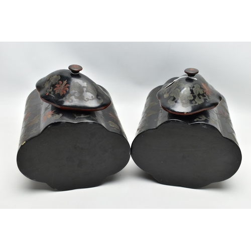 999A - A PAIR OF ORIENTAL BLACK LACQUERED PAPIER MACHE TEA CANNISTERS AND COVERS OF SHAPED OVAL FORM, the d... 