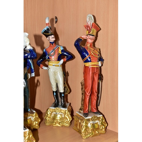 303 - SIX CAPODIMONTE BRUNO MERLI FIGURES OF SOLDIERS IN HISTORICAL COSTUME OF 1798-1844 AND A GOEBEL MILI... 