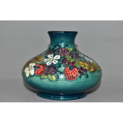315 - A MOORCROFT POTTERY CAROUSEL PATTERN VASE, of squat form, tube lined with flowers, berries and folia... 