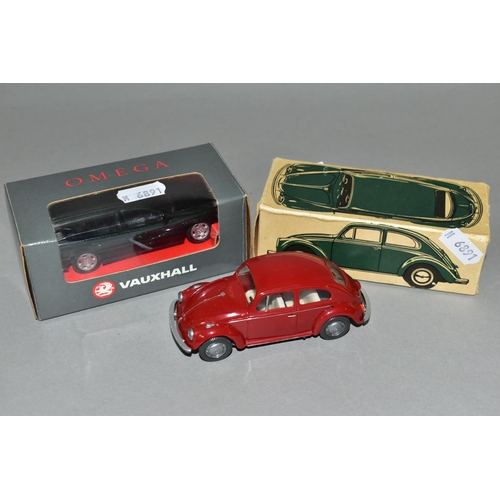 316 - TWO BOXED MODEL CARS, comprising a Wiking plastic Volkswagen Beetle Mod. 113, with a red body, and a... 