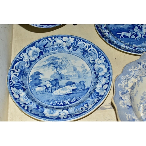 334 - FOUR PIECES OF ANTIQUE BLUE AND WHITE TRANSFER WARES, to include a meat plate printed with a rural v... 