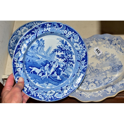 334 - FOUR PIECES OF ANTIQUE BLUE AND WHITE TRANSFER WARES, to include a meat plate printed with a rural v... 