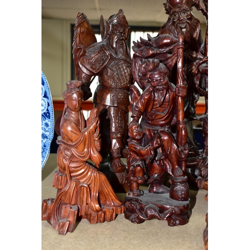 347 - A GROUP OF SEVEN CARVED WOOD ORIENTAL FIGURES, comprising two large Shou Lao (God of Longevity) figu... 