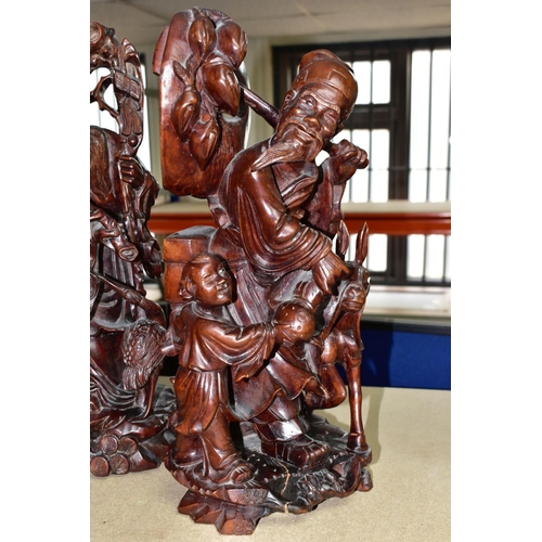 347 - A GROUP OF SEVEN CARVED WOOD ORIENTAL FIGURES, comprising two large Shou Lao (God of Longevity) figu... 