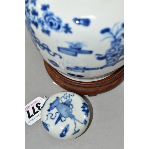 377 - A CHINESE BLUE AND WHITE JAR AND COVER WITH WOODEN STAND, the jar and cover decorated with vases of ... 