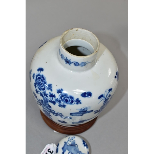 377 - A CHINESE BLUE AND WHITE JAR AND COVER WITH WOODEN STAND, the jar and cover decorated with vases of ... 