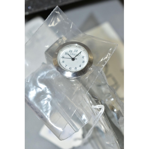 381 - A BOXED MODERN LALIQUE 'CLOCK HULOTTE', the curved glass case moulded with owls, the quartz movement... 