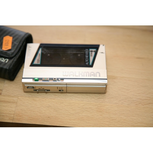 878 - A SONY WM-40 STEREO CASSETTE PLAYER with padded case condition is very good, motor turns but tape do... 