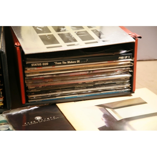 942 - TWO RECORD CASES CONTAINING OVER SIXTY LPs OF ROCK MUSIC including WWA copies of Vol.4 and Master of... 