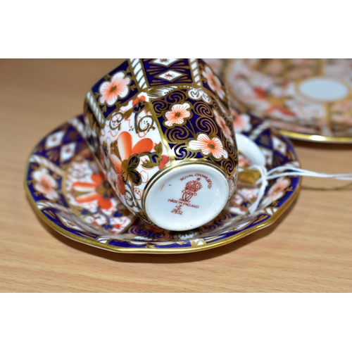 386 - A ROYAL CROWN DERBY COFFEE TRIO IN IMARI 2451 PATTERN, bearing date codes for 1920, 1932 and 1933 (3... 