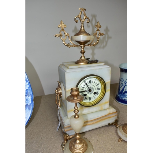 417 - A LATE 19TH CENTURY FRENCH MARBLE CLOCK GARNITURE with  key, a cream enamel dial marked Comptoir Gen... 