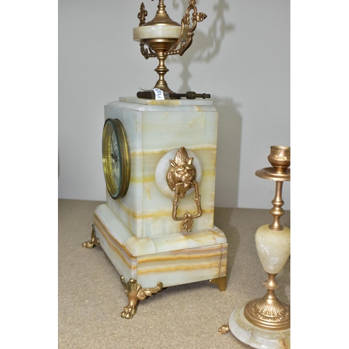 417 - A LATE 19TH CENTURY FRENCH MARBLE CLOCK GARNITURE with  key, a cream enamel dial marked Comptoir Gen... 