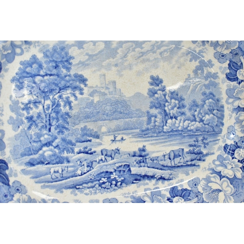 425 - TWO 19TH CENTURY BLUE AND WHITE MEAT PLATES, one is decorated with Eton College with a floral border... 