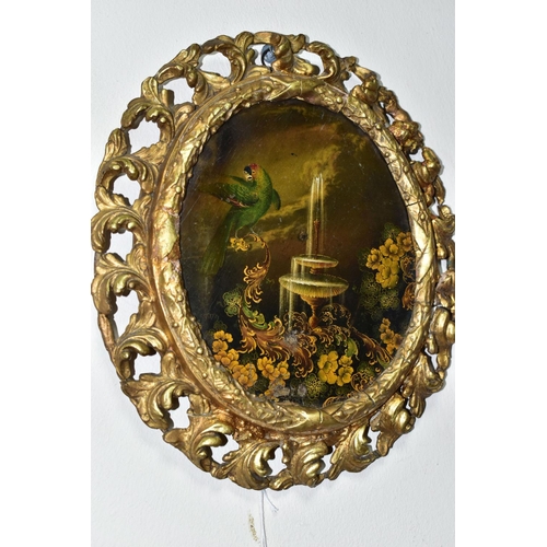 437 - A 19TH CENTURY GILT FRAMED OVAL PAPIER MACHÉ PAINTING, of an exotic parrot, fountain and foliate des... 