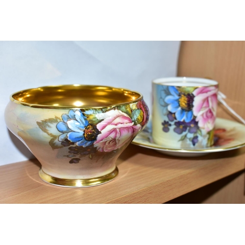 447 - AN AYNSLEY FLORAL DECORATED COFFEE CAN, SAUCER AND SUGAR BOWL BY J. A. BAILEY, the sugar bowl of sho... 