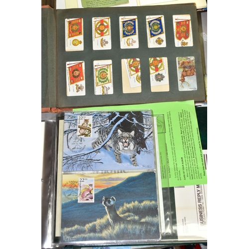 523 - POSTCARDS, 1st DAY COVERS & EPHEMERA, three albums containing approximately 310 postcards dating fro... 