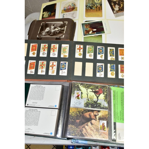 523 - POSTCARDS, 1st DAY COVERS & EPHEMERA, three albums containing approximately 310 postcards dating fro... 