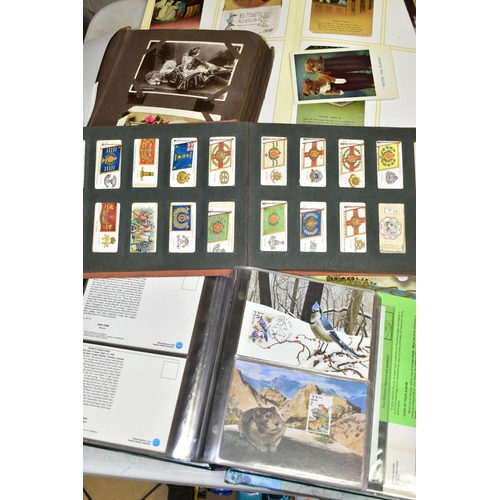 523 - POSTCARDS, 1st DAY COVERS & EPHEMERA, three albums containing approximately 310 postcards dating fro... 