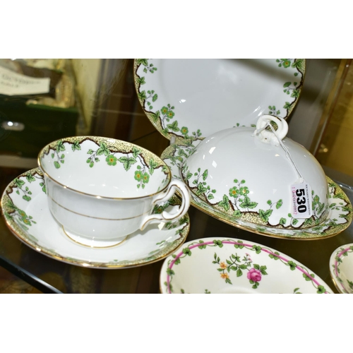 530 - A GROUP OF AYNSLEY TEA AND BREAKFAST WARES, comprising an Emerald Isle tea cup, saucer, covered muff... 