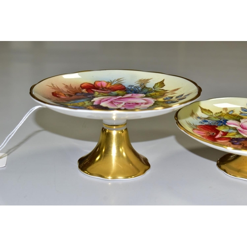 539 - TWO AYNSLEY FLORAL DECORATED PEDESTAL DISHES BY J. A. BAILEY, with wavy rims and gilt bases, both be... 