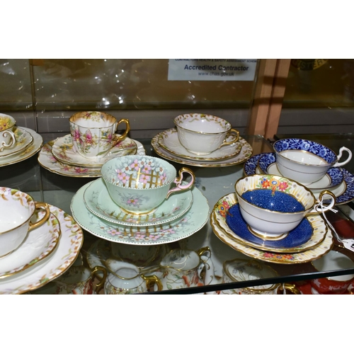 542 - TWELVE AYNSLEY TRIOS, including antique and vintage china, floral patterns in different styles to in... 