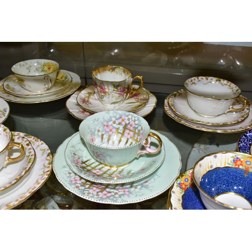 542 - TWELVE AYNSLEY TRIOS, including antique and vintage china, floral patterns in different styles to in... 