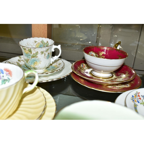 542 - TWELVE AYNSLEY TRIOS, including antique and vintage china, floral patterns in different styles to in... 