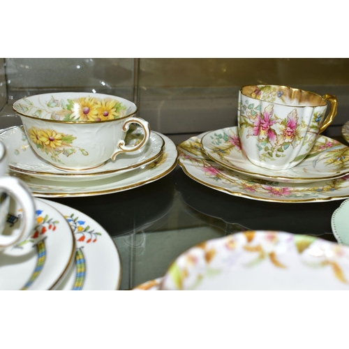 542 - TWELVE AYNSLEY TRIOS, including antique and vintage china, floral patterns in different styles to in... 