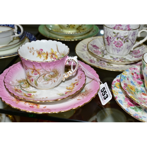 553 - A GROUP OF AYNSLEY AND OTHER TRIOS, CUPS AND SAUCERS, assorted patterns to include a pink rimmed tri... 