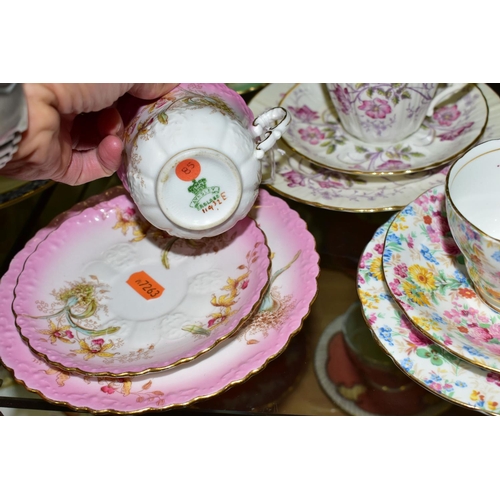 553 - A GROUP OF AYNSLEY AND OTHER TRIOS, CUPS AND SAUCERS, assorted patterns to include a pink rimmed tri... 