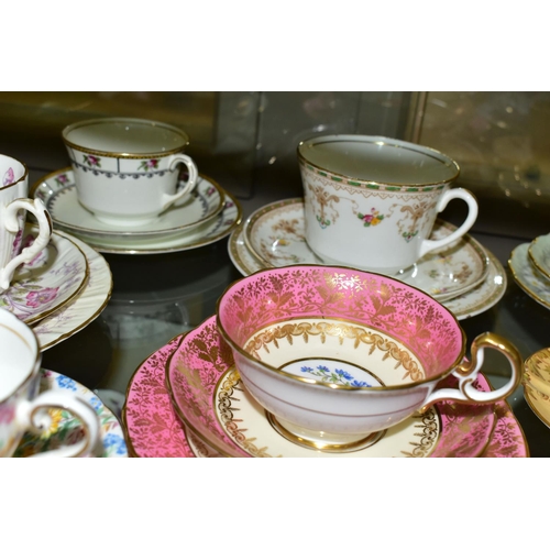 553 - A GROUP OF AYNSLEY AND OTHER TRIOS, CUPS AND SAUCERS, assorted patterns to include a pink rimmed tri... 