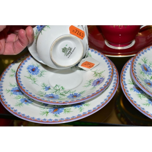 554 - A GROUP OF AYNSLEY TRIOS  AND SOUP BOWLS,  comprising two soup bowls with two saucers in the 'Queen'... 