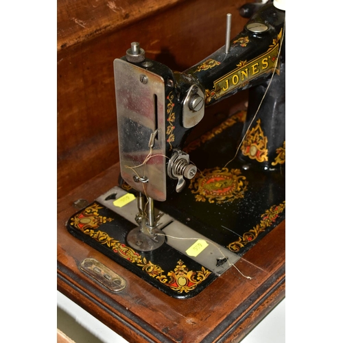 559 - AN EDWARDIAN JONES SEWING MACHINE, with a wooden carry case, model No. 288479 as supplied to her Maj... 