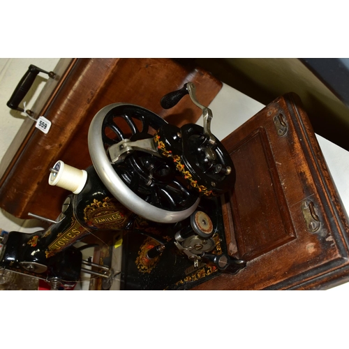 559 - AN EDWARDIAN JONES SEWING MACHINE, with a wooden carry case, model No. 288479 as supplied to her Maj... 