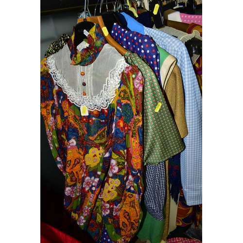 570 - A COLLECTION OF VINTAGE LADIES CLOTHING INCORPORATING STYLES FROM THE 1960'S AND 1970'S, comprising ... 