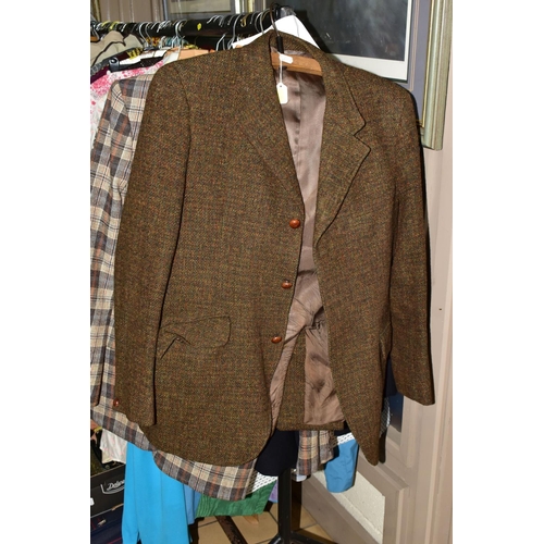 571 - A RAIL OF THIRTY TWO ITEMS OF ASSORTED VINTAGE CLOTHING comprising a gentleman's original Harris twe... 