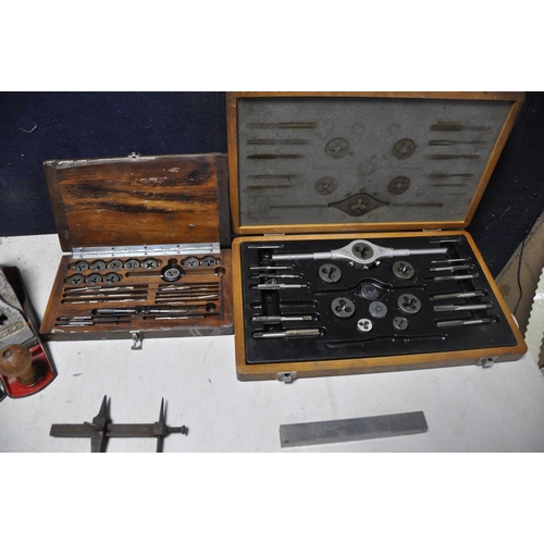 1057 - A COLLECTION OF VINTAGE TOOLS to include two cased tap and die sets, Stanley bailey No4 plane, Acorn... 