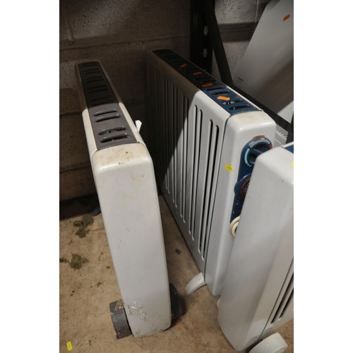 1103 - A COLLECTION OF RADIATORS to include three dimplex RMG20TI heaters, a Currys convector heater and tw... 