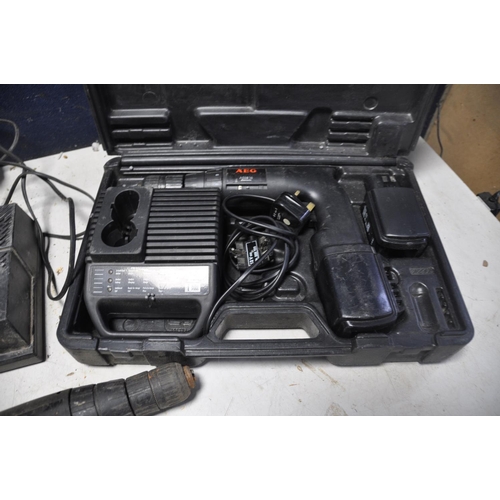 1122 - A AEG ASB516 CORDLESS DRILL in case with spare battery and charger along with another AEG cordless d... 