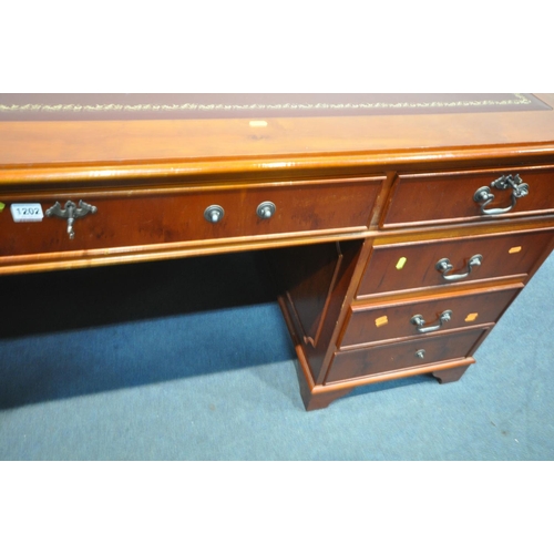 1202 - A 20TH CENTURY CHERRYWOOD TWIN PEDESTAL DESK, with burgundy and tooled leather writing surface, and ... 