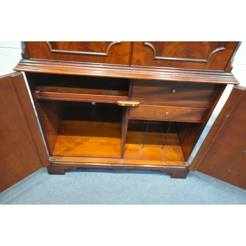 1205 - A MODERN MAHOGANY TV CABINET, top section with one adjustable shelf and a single drawer, base enclos... 