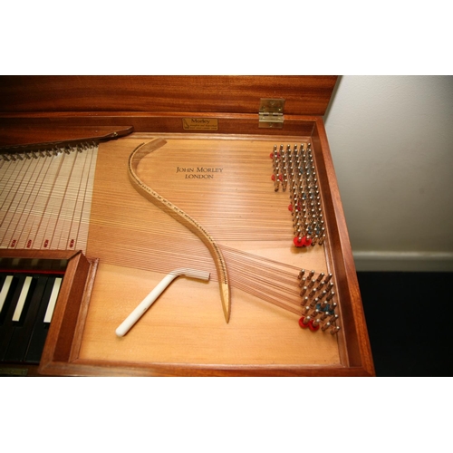 879 - A JOHN MORLEY BACH CLAVICHORD in a medium Walnut Veneered finish, ebony keys with receipts and paper... 