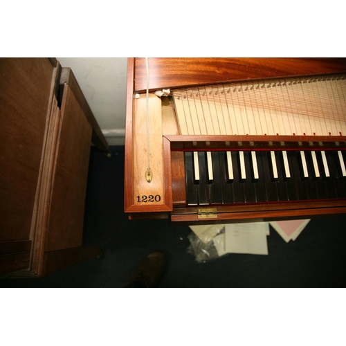 879 - A JOHN MORLEY BACH CLAVICHORD in a medium Walnut Veneered finish, ebony keys with receipts and paper... 