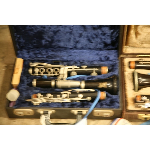 889 - TWO CASED CLARINETS one a Crompton and Co Buffet, Paris mouthpiece marked 5RV and a Boosey and Hawke... 