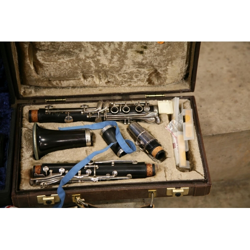 889 - TWO CASED CLARINETS one a Crompton and Co Buffet, Paris mouthpiece marked 5RV and a Boosey and Hawke... 