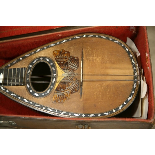 891 - A STRIDENTE, NAPOLI BOWL BACK MANDOLIN with butterfly inlay to front, in tatty leather case. Conditi... 