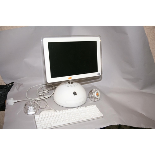 893 - AN APPLE iMAC G4 M6498 PERSONAL COMPUTER with 1.25Hz /256Mb/80HD, wired keyboard and mouse and a pai... 