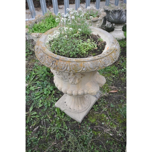 1010 - A COMPOSITE CAMPAGNA STYLE GARDEN URN with twin mask handles height 65cm